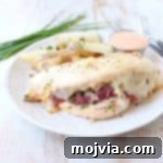 Reuben Stuffed Chicken: Tender chicken breasts filled with corned beef, sauerkraut, Thousand Island dressing, and Swiss cheese, baked to perfection.