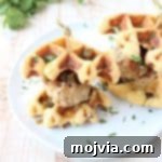 Jalapeño Honey Chicken & Pork Meatballs are sandwiched between Jalapeño Bacon Cornbread Waffles in this delicious recipe for Meatball Sliders, putting a new, fun twist on chicken & waffles!