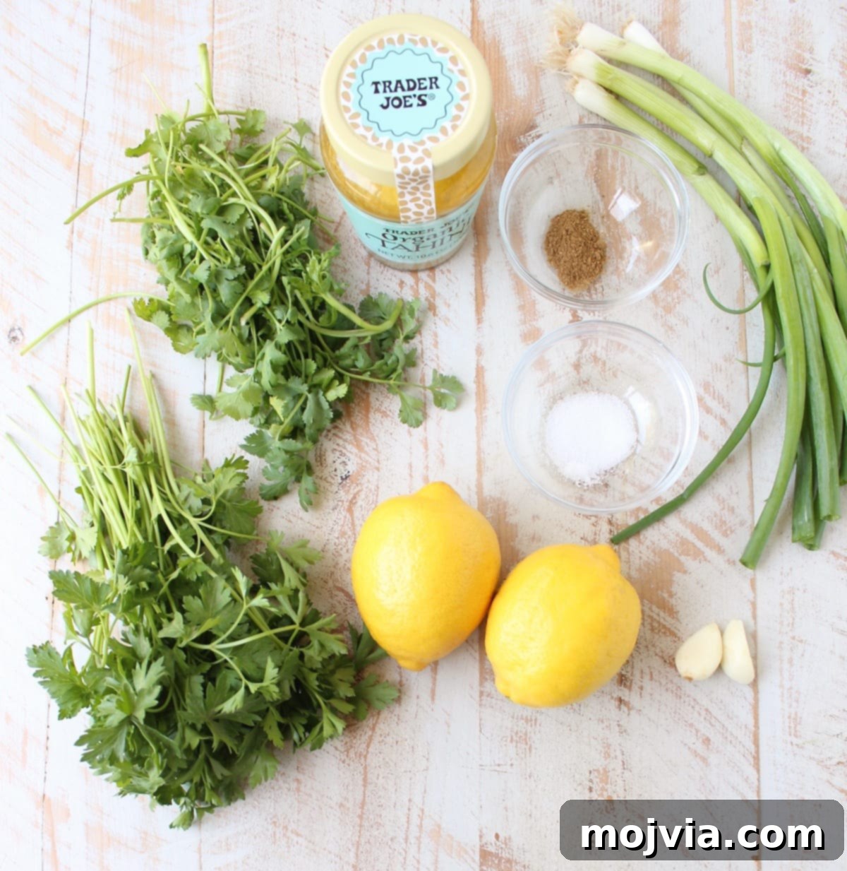 This healthy, vegan and gluten free Green Tahini Sauce Recipe is perfect for topping buddha bowls, chicken and fish, or serve it as a dip with veggies!