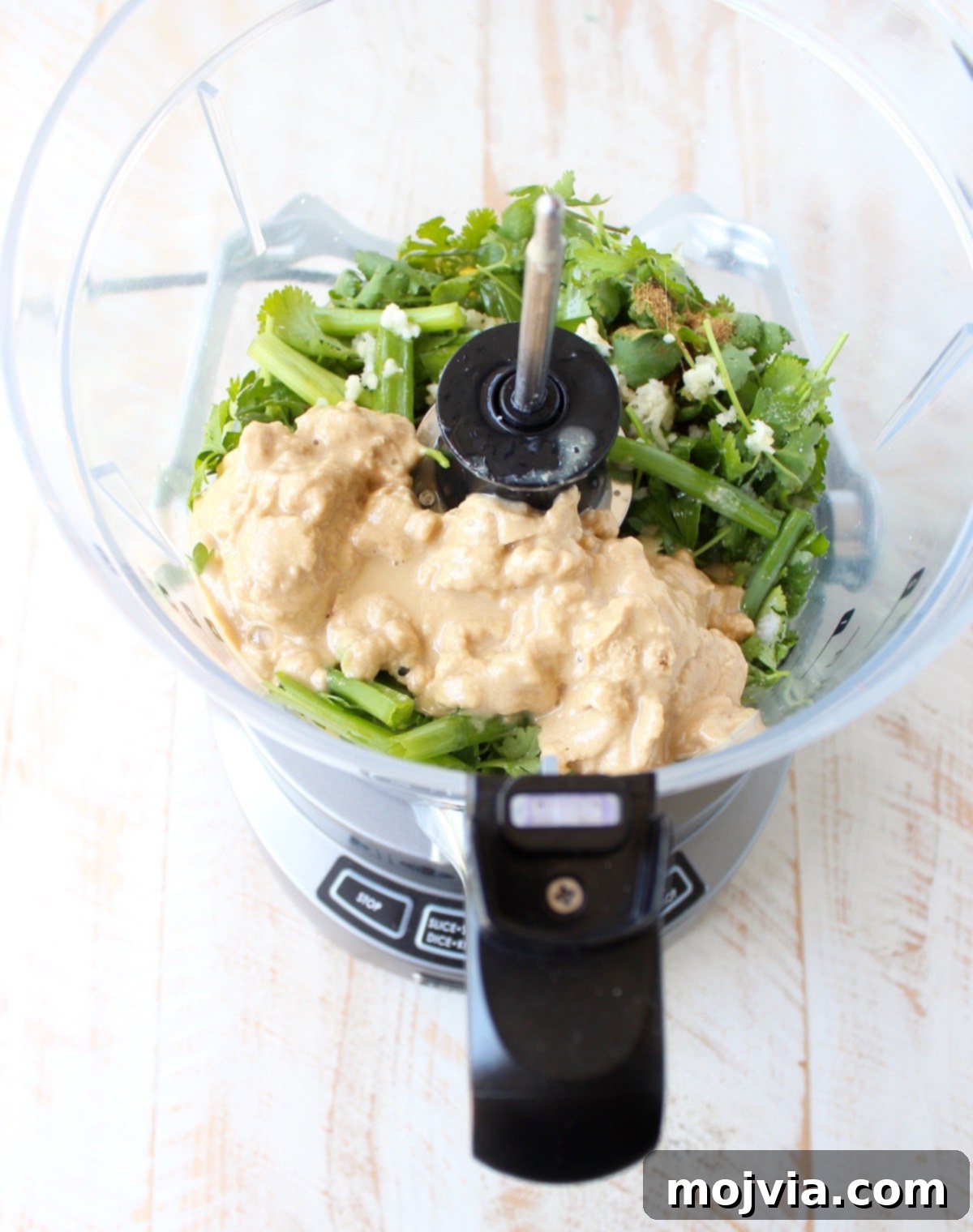 This healthy, vegan and gluten free Green Tahini Sauce Recipe is perfect for topping buddha bowls, chicken and fish, or serve it as a dip with veggies!