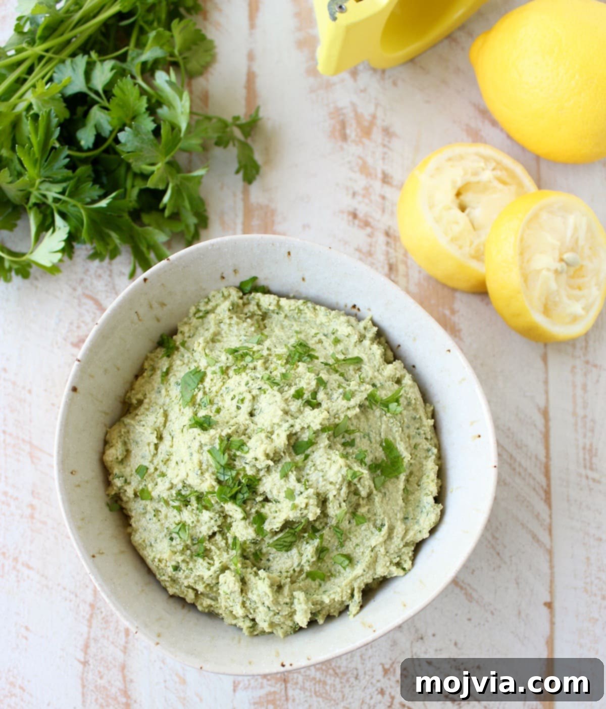 This healthy, vegan and gluten free Green Tahini Sauce Recipe is perfect for topping buddha bowls, chicken and fish, or serve it as a dip with veggies!