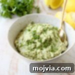 This healthy, vegan and gluten free Green Tahini Sauce Recipe is perfect for topping buddha bowls, chicken and fish, or serve it as a dip with veggies!