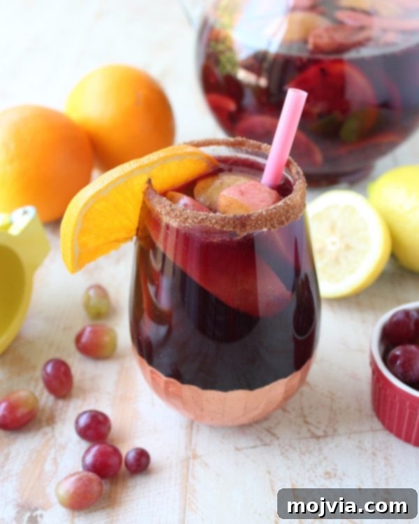 Ember-Kissed Fruit Sangria 2 Red Wine Sangria is given a delicious twist in this refreshing cocktail recipe that features cinnamon sugar grilled peaches, apples, oranges and lemons!