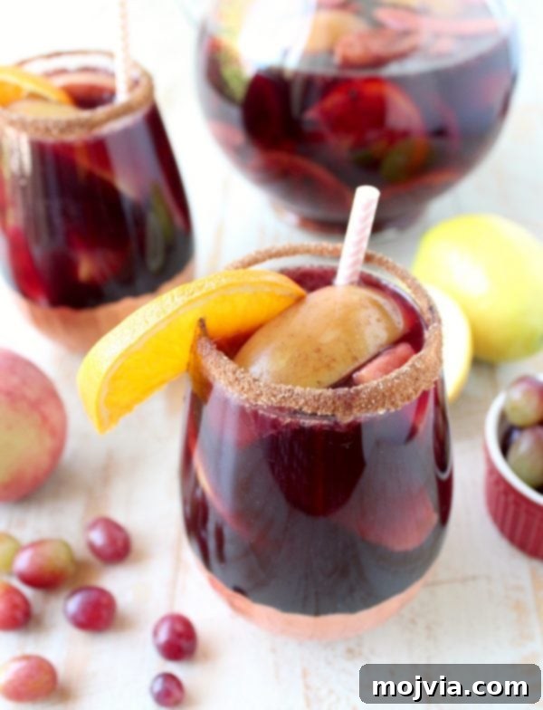 Ember-Kissed Fruit Sangria 3 Red Wine Sangria is given a delicious twist in this refreshing cocktail recipe that features cinnamon sugar grilled peaches, apples, oranges and lemons!