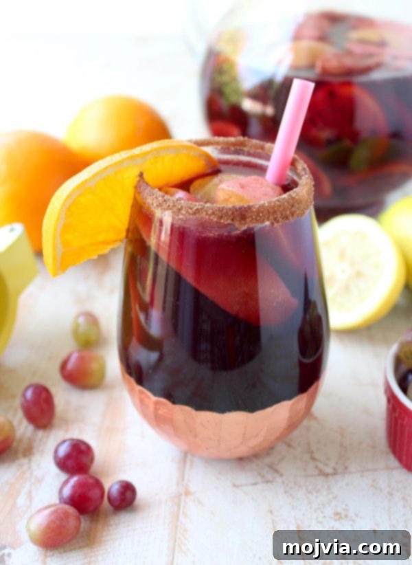 Ember-Kissed Fruit Sangria 4 Red Wine Sangria is given a delicious twist in this refreshing cocktail recipe that features cinnamon sugar grilled peaches, apples, oranges and lemons!