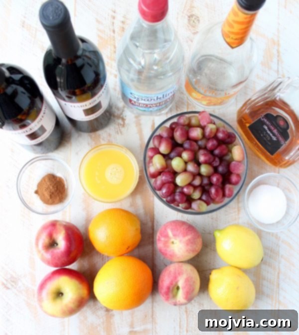 Ember-Kissed Fruit Sangria 5 Red Wine Sangria is given a delicious twist in this refreshing cocktail recipe that features cinnamon sugar grilled peaches, apples, oranges and lemons!