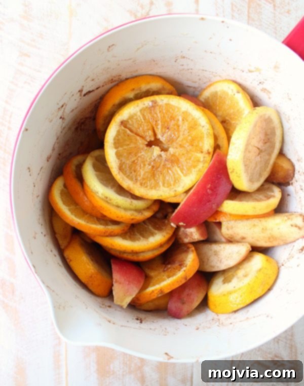 Ember-Kissed Fruit Sangria 6 Red Wine Sangria is given a delicious twist in this refreshing cocktail recipe that features cinnamon sugar grilled peaches, apples, oranges and lemons!