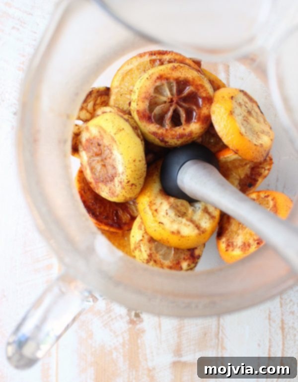 Ember-Kissed Fruit Sangria 7 Red Wine Sangria is given a delicious twist in this refreshing cocktail recipe that features cinnamon sugar grilled peaches, apples, oranges and lemons!