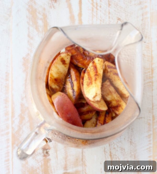 Ember-Kissed Fruit Sangria 8 Red Wine Sangria is given a delicious twist in this refreshing cocktail recipe that features cinnamon sugar grilled peaches, apples, oranges and lemons!