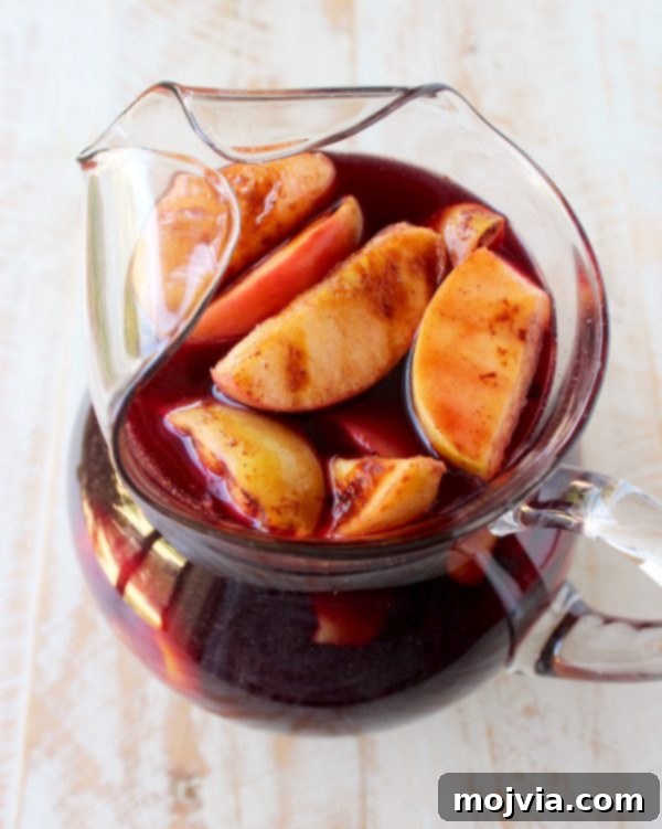 Ember-Kissed Fruit Sangria 9 Red Wine Sangria is given a delicious twist in this refreshing cocktail recipe that features cinnamon sugar grilled peaches, apples, oranges and lemons!
