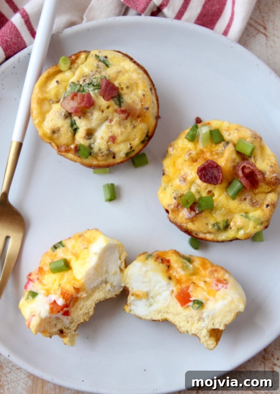 Healthy zero carb egg muffins served on a white plate with a fork, ready to be enjoyed