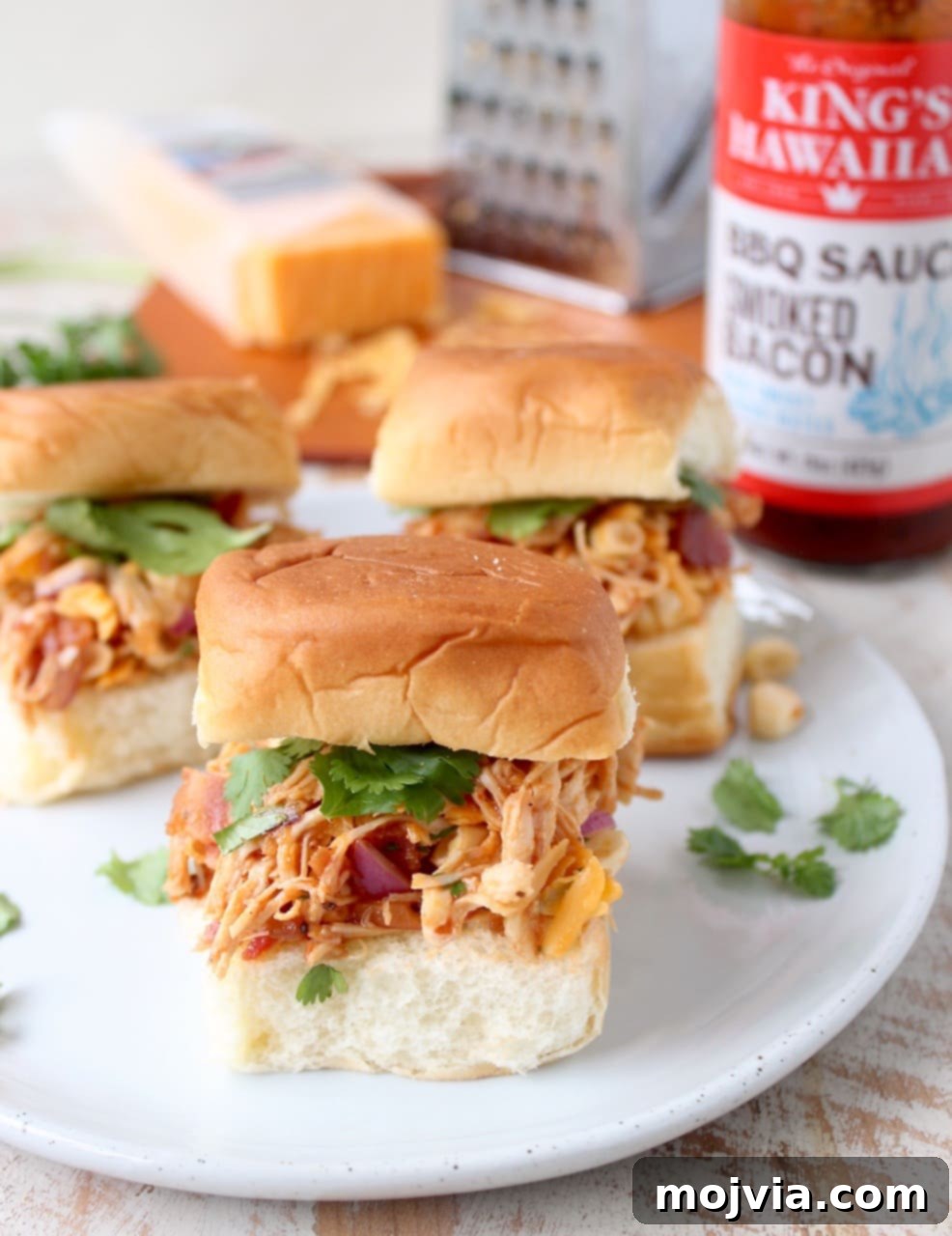 Sweet & Smoky BBQ Chicken Salad Sliders 2 Delicious BBQ Chicken Salad Sliders made with shredded chicken, cheddar, bacon, corn, and red onions on sweet Hawaiian rolls, perfect for any gathering.