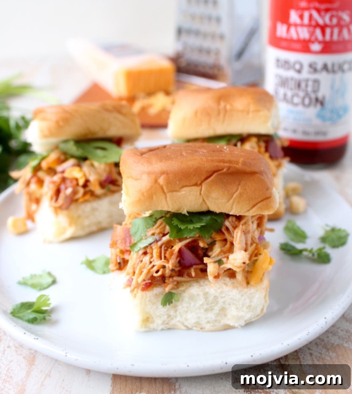 Sweet & Smoky BBQ Chicken Salad Sliders 4 A tray of freshly assembled BBQ Chicken Salad Sliders, ready to be served, highlighting their vibrant colors and appealing presentation.