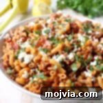In just one pot and under 45 minutes, make a delicious Greek Pasta recipe filled with sun dried tomatoes, ground turkey, capers and feta cheese!