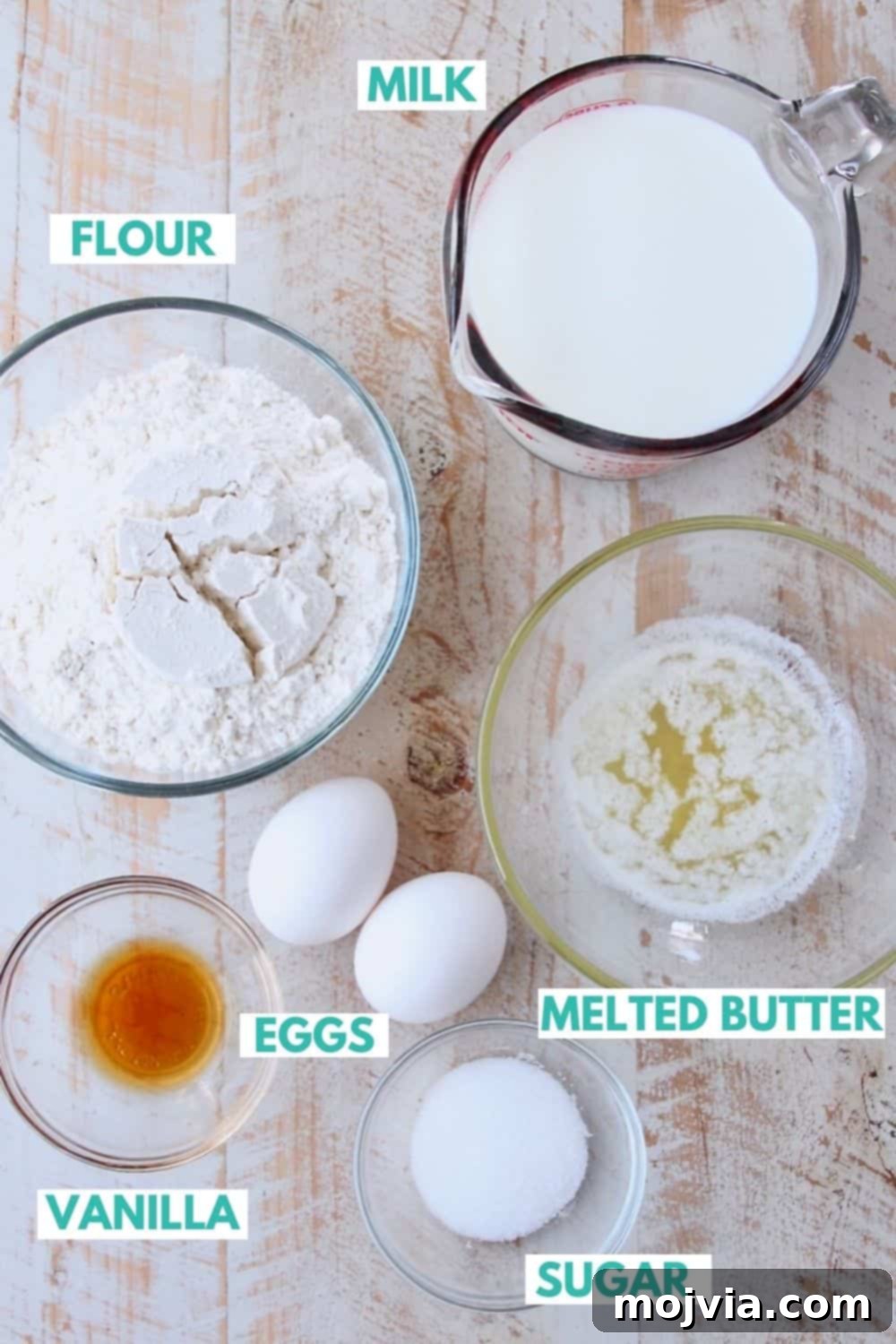 Authentic French Crepes Made Easy 3 Ingredients for homemade crepes on a white wood board