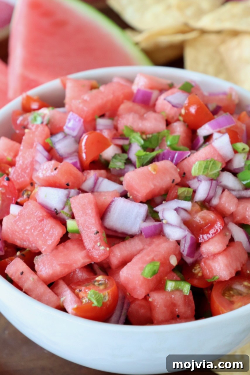 Sweet Heat Watermelon Salsa 2 A glistening bowl of homemade watermelon salsa, ready to be served