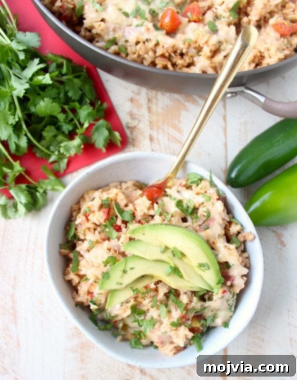 One Pan Zesty Turkey Taco Rice 4 Close-up of the delicious One Pot Turkey Taco Rice Skillet, showing the vibrant ingredients and melted cheese