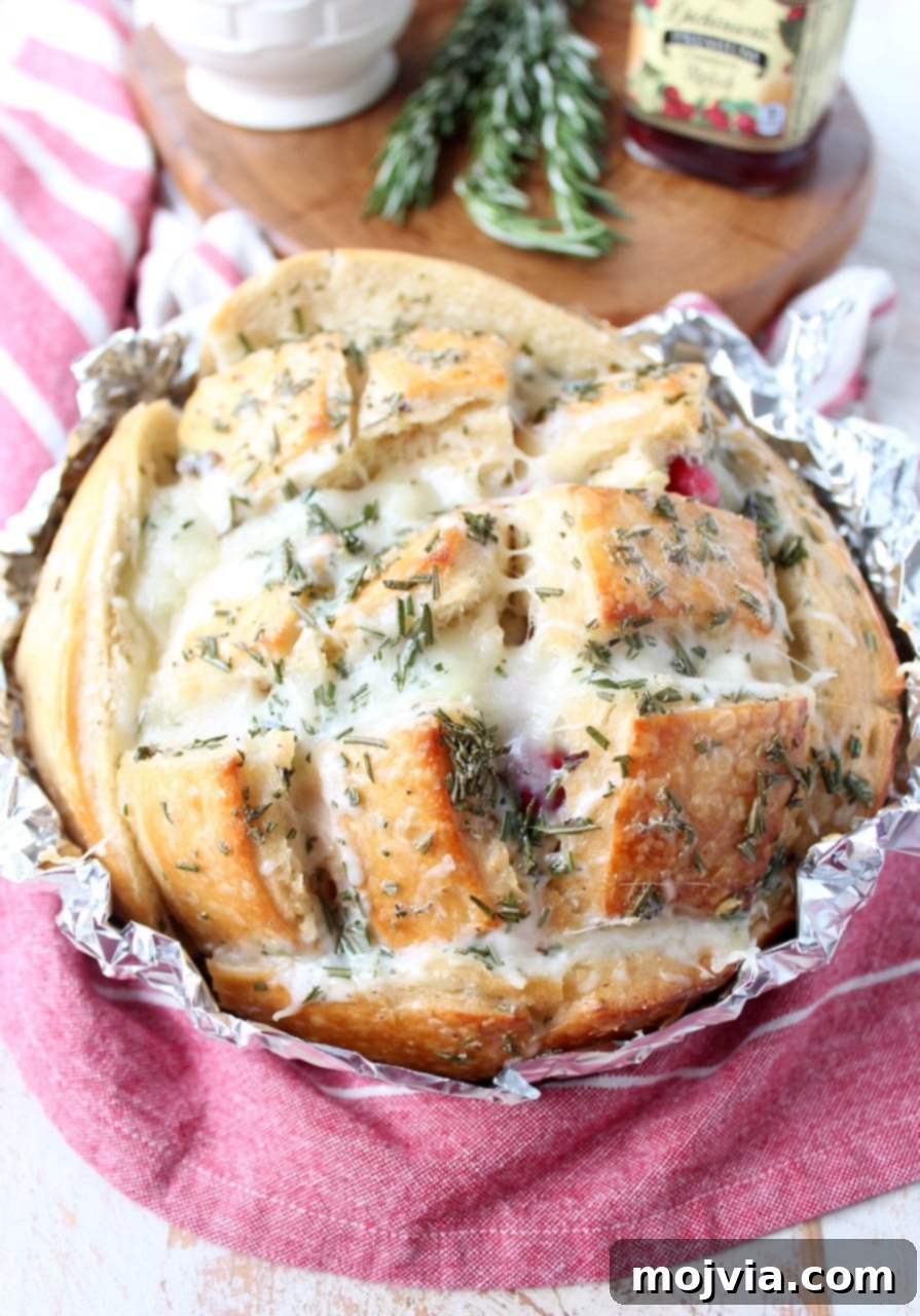 Savory Cranberry Turkey Mozzarella Tear-and-Share Loaf 2 Leftover Thanksgiving turkey & cranberry sauce is made into a delicious pull apart bread recipe filled with mozzarella cheese & topped with rosemary butter!