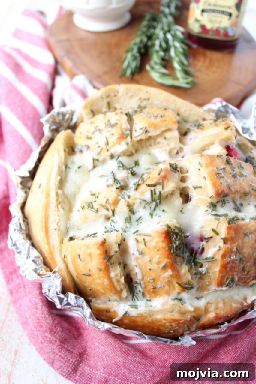 Savory Cranberry Turkey Mozzarella Tear-and-Share Loaf 5 Leftover Thanksgiving turkey & cranberry sauce is made into a delicious pull apart bread recipe filled with mozzarella cheese & topped with rosemary butter!