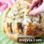 Savory Cranberry Turkey Mozzarella Tear-and-Share Loaf 6 Leftover Thanksgiving turkey & cranberry sauce is made into a delicious pull apart bread recipe filled with mozzarella cheese & topped with rosemary butter!