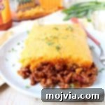 Cheesy Buffalo Chili Cornbread Bake 8 Traditional cornbread chili pie is kicked up a notch in this downright delicious version made with buffalo sauce and cheddar cheese!