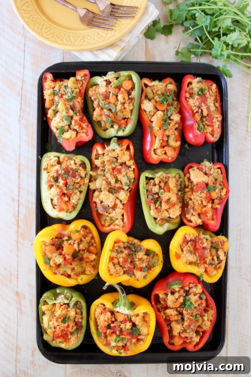 Vibrant Buffalo Chicken Stuffed Bell Peppers on a baking sheet, ready to be served as a healthy, Whole30 compliant meal.