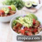Taco seasoned ground turkey cooked with peppers, onions and tomatoes, tops this gluten free, dairy free, Whole30 taco salad recipe, made in just 20 minutes!