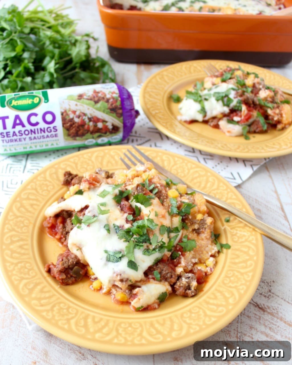 A serving of the delicious gluten-free taco casserole on a plate, showcasing its rich layers of turkey, polenta, and cheese.