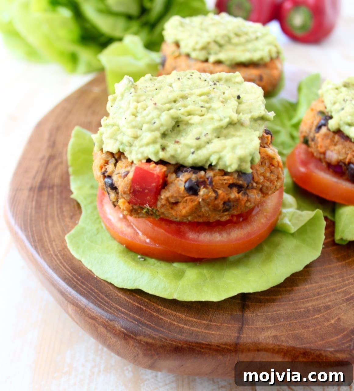 Quinoa, sweet potatoes, black beans & veggies are combined in this healthy, gluten free, black bean veggie burger recipe, which can be prepped ahead and stored in the refrigerator or freezer! Black Bean Veggie Burger with Lettuce Tomato and Avocado