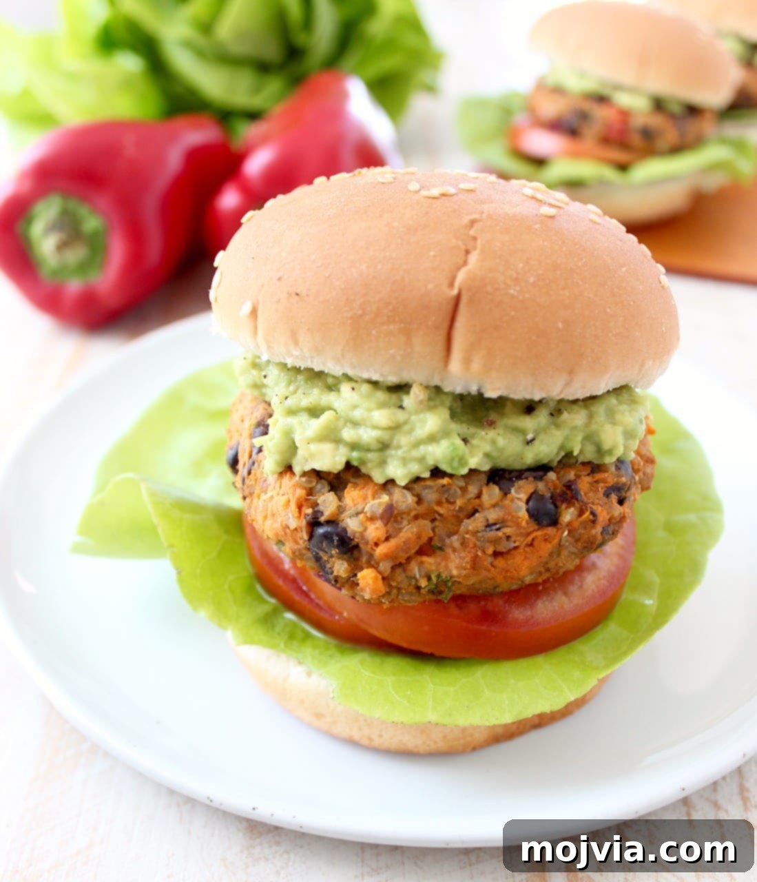 Quinoa, sweet potatoes, black beans & veggies are combined in this healthy, gluten free, black bean veggie burger recipe, which can be prepped ahead and stored in the refrigerator or freezer! Veggie Burger on Bun