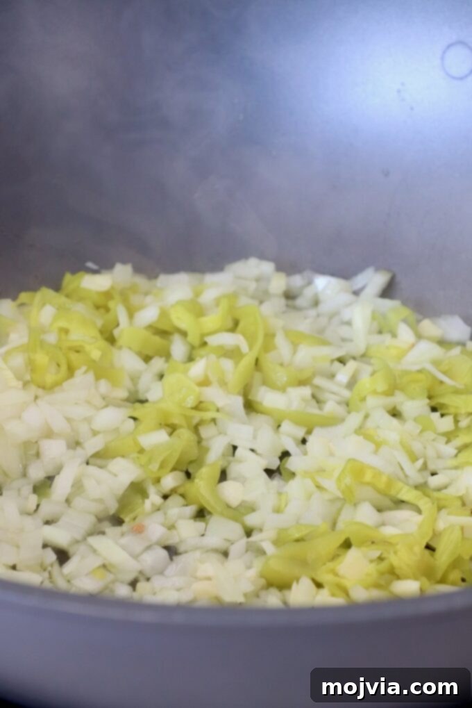 Boozy Italian Pasta 4 diced onions and sliced pepperoncinis in large pan