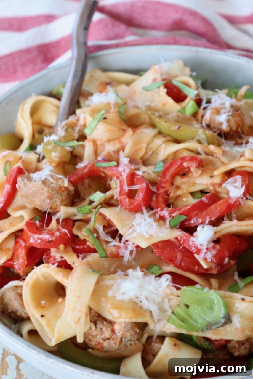 Boozy Italian Pasta 8 cooked pasta in bowl with bell peppers and basil leaves