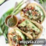 Vegan Tacos filled with Grilled Vegetables, Chimichurri Sauce and Fresh Avocado Slices