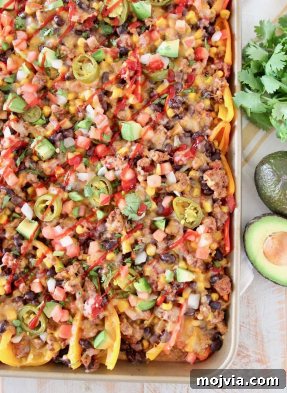 nachos made with sweet mini peppers, covered in taco seasoned ground turkey, corn, tomatoes, black beans, cheese and jalapenos