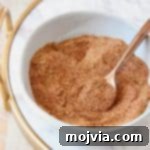 Homemade taco seasoning mixed in bowl with spoon, ready to be stored
