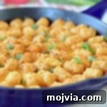 Loaded Buffalo Cheeseburger Tater Tot Casserole 2 Buffalo cheeseburger tater tot casserole in skillet with green onions