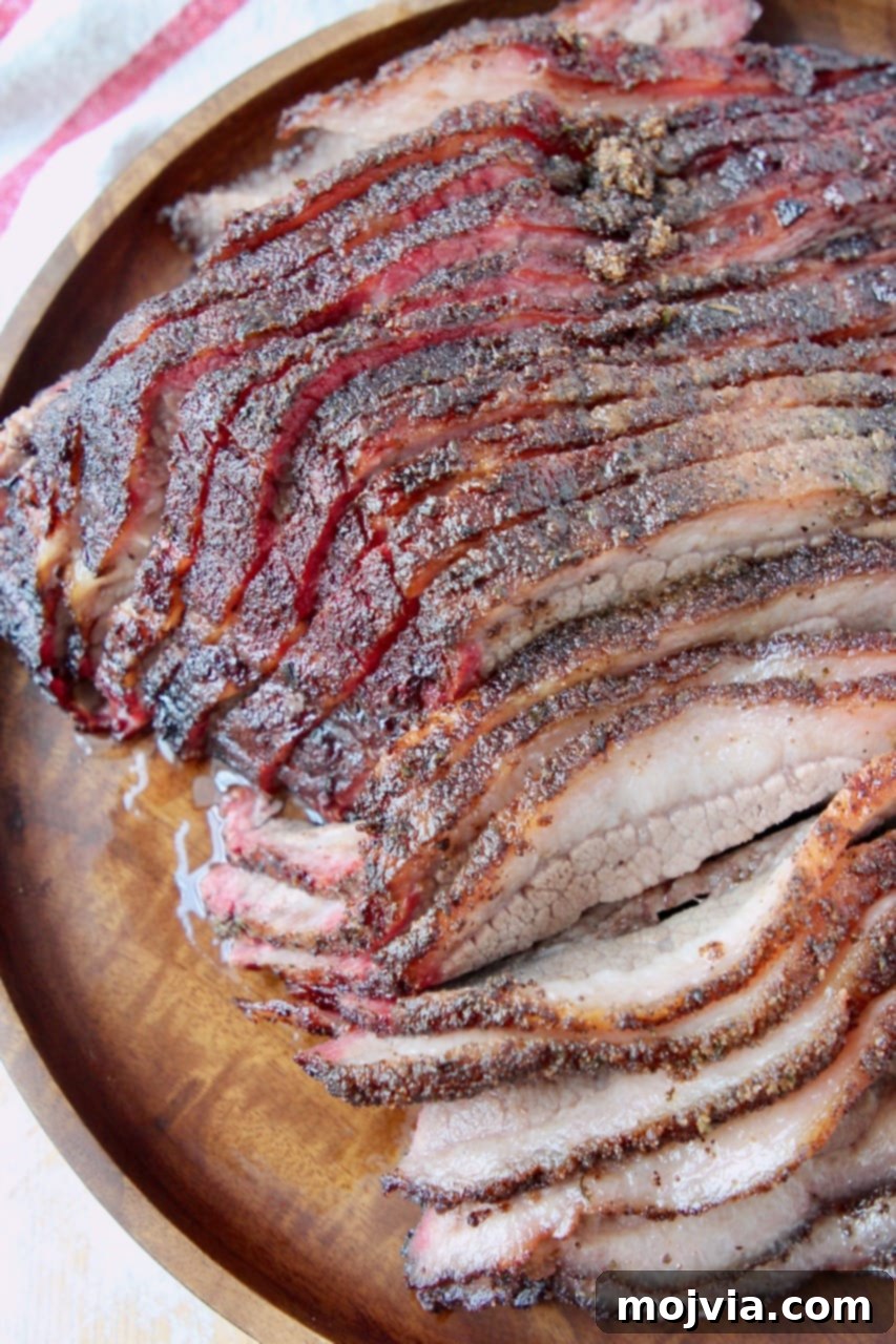Perfectly sliced smoked brisket resting on a rustic wooden serving platter, ready to be enjoyed.