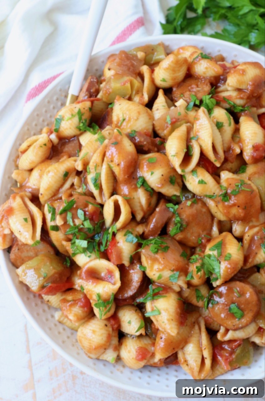 Spicy Cajun One-Pan Pasta 6 One Pot Cajun Pasta served in a large bowl with a fork, showing the rich, saucy texture.
