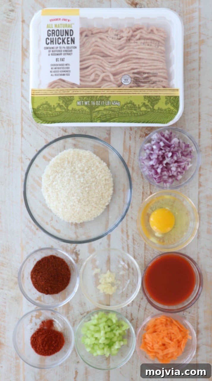 Fiery Buffalo Chicken Burgers 3 ingredients for buffalo chicken burgers on white wood board