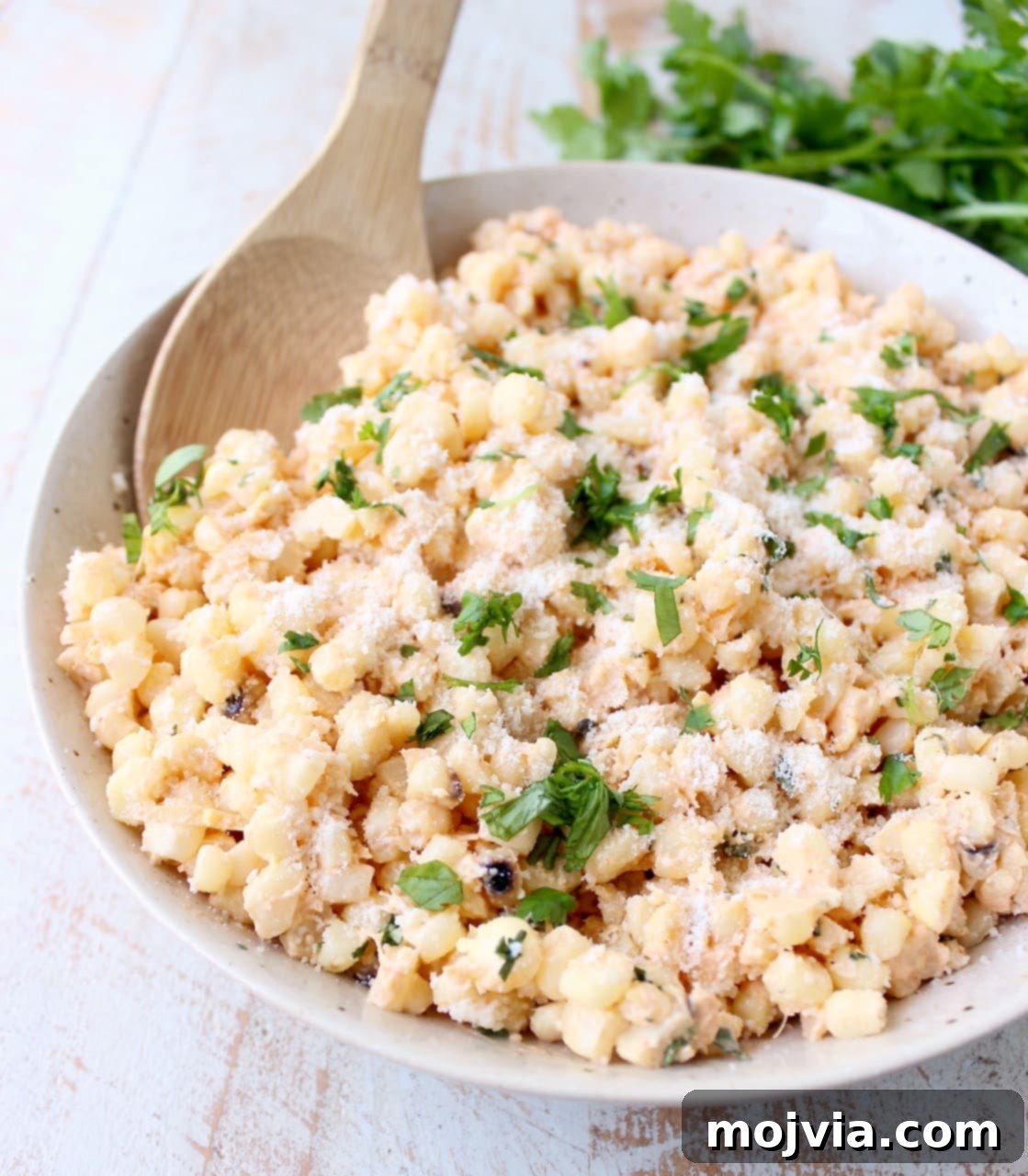 Mexican Street Corn Salad 2 Deconstructed Mexican Street Corn combines grilled corn "off the cob", cilantro, sour cream, lime juice & parmesan cheese for an amazingly flavorful side dish recipe!