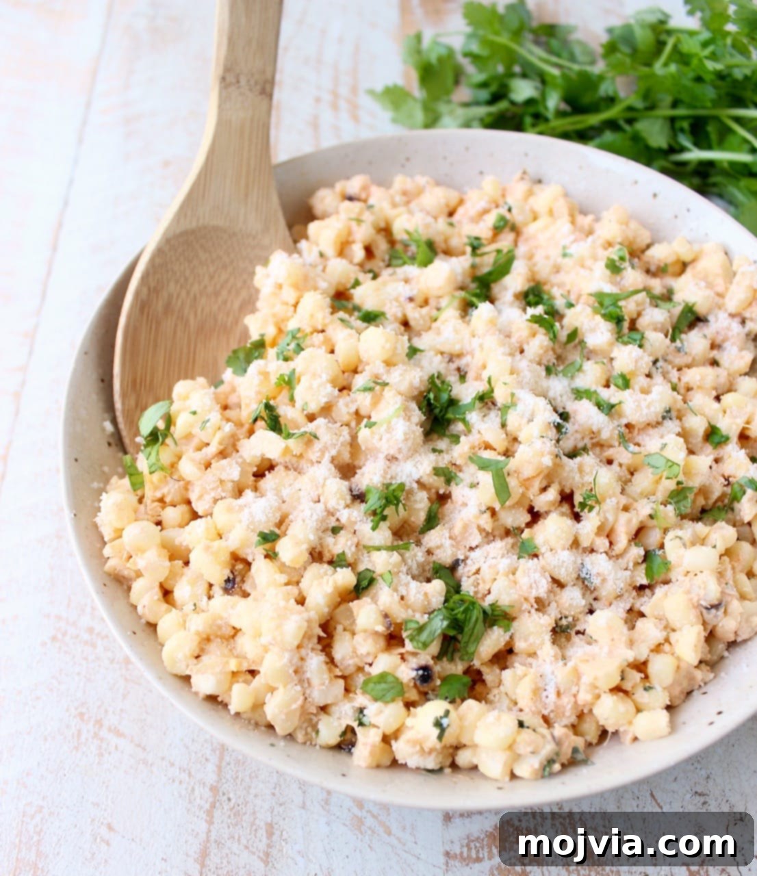 Mexican Street Corn Salad 8 Deconstructed Mexican Street Corn combines grilled corn "off the cob", cilantro, sour cream, lime juice & parmesan cheese for an amazingly flavorful side dish recipe!