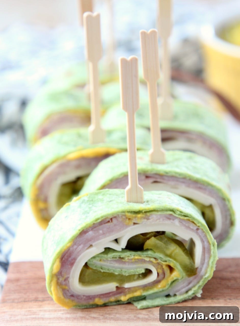 Cuban sandwich pinwheels on cutting board with toothpicks, ready to be served