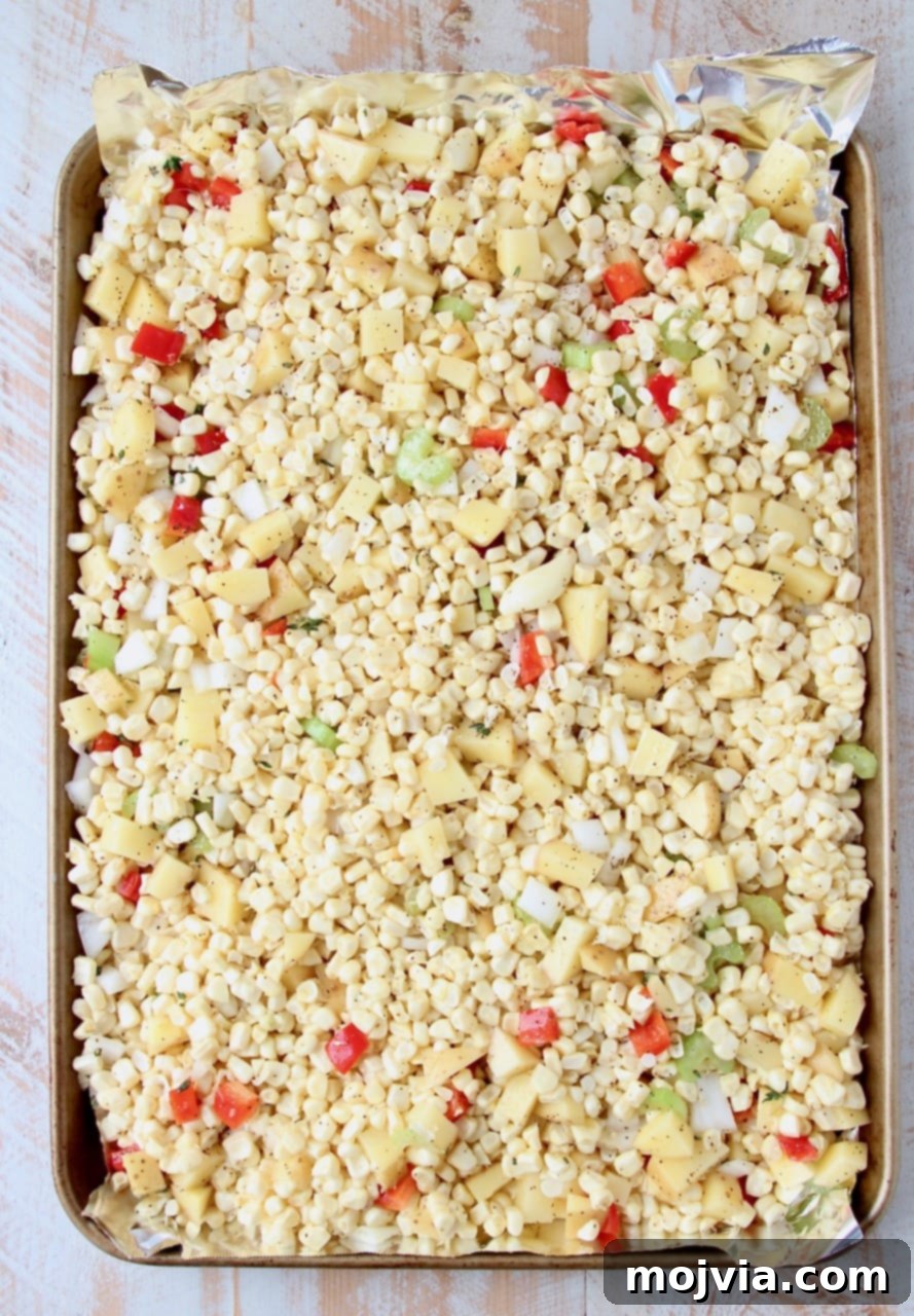 Golden Creamed Corn Soup 3 Corn, diced peppers and onions on foil lined baking sheet