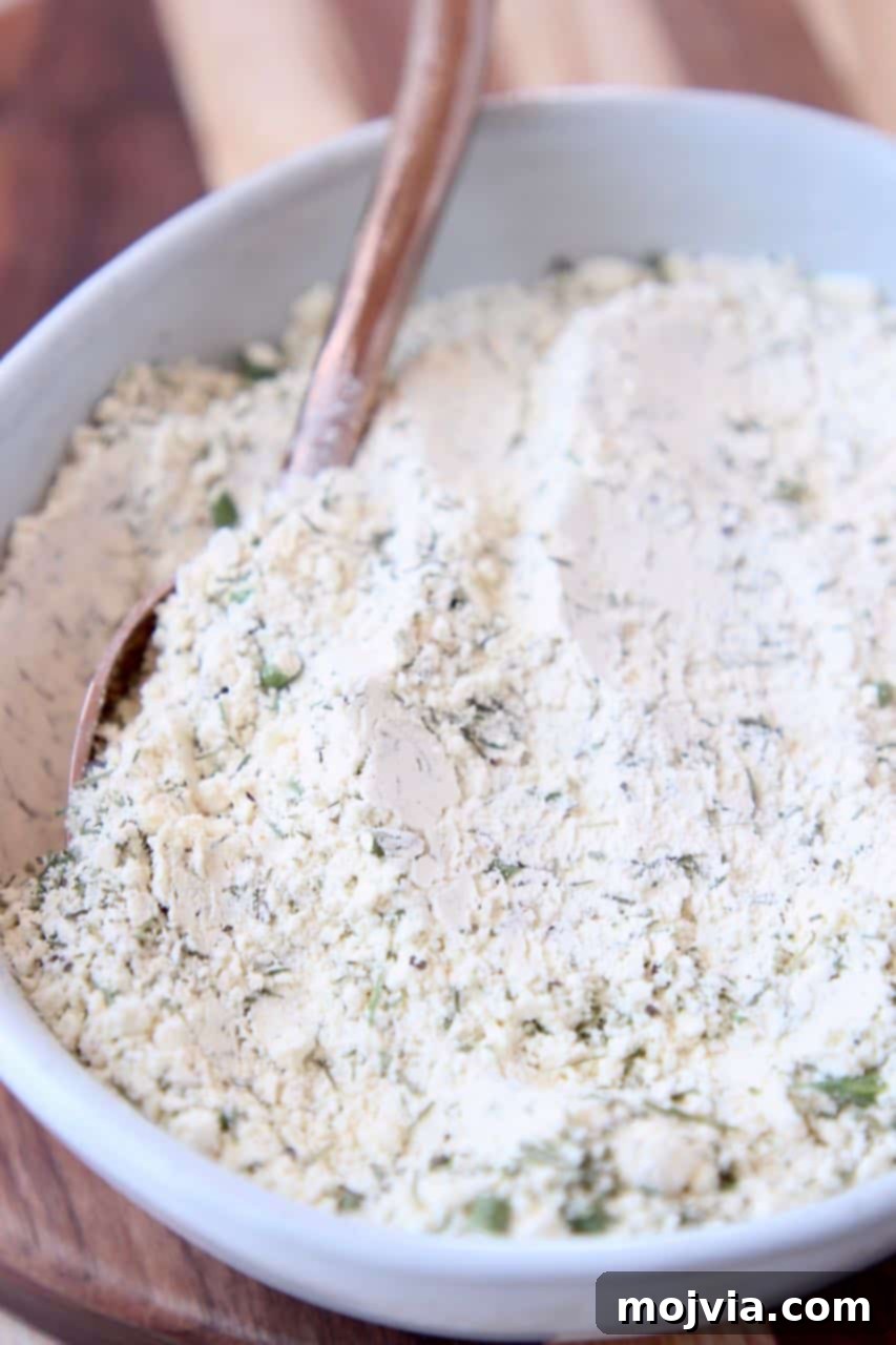 Ultimate Homemade Ranch Spice Blend 3 Ranch seasoning mix in bowl with spoon
