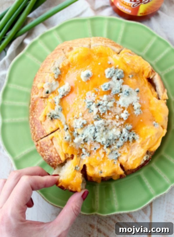 Set It and Forget It Buffalo Chicken 7 Everyone's favorite buffalo chicken dip is baked right into a bread bowl for the perfect party, game day or weekend appetizer!