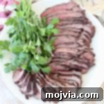 Sliced grilled tri tip steak on plate