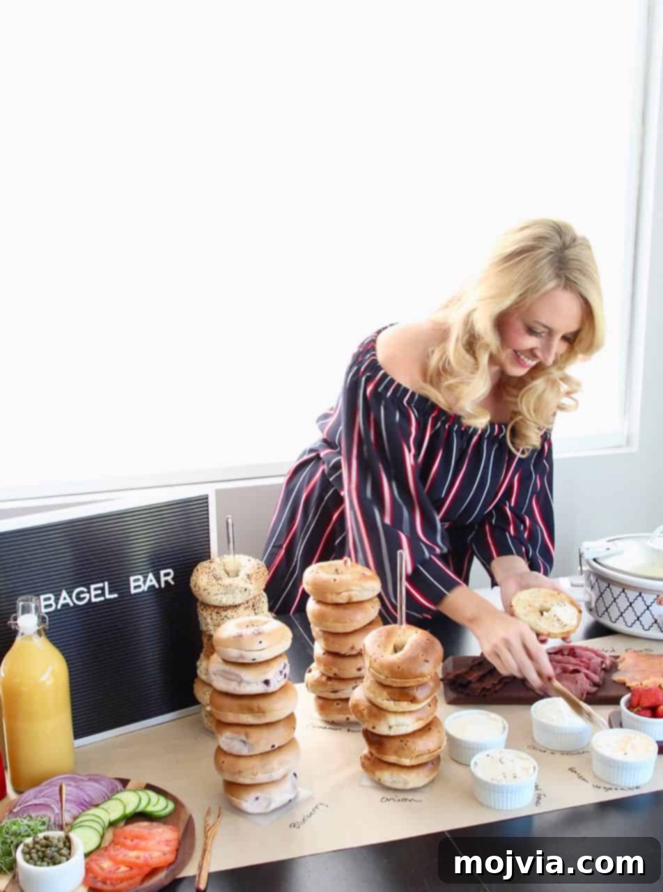 The Easy Bagel Bar Blueprint 4 A person spreading cream cheese on a freshly toasted bagel at a bustling bagel bar.