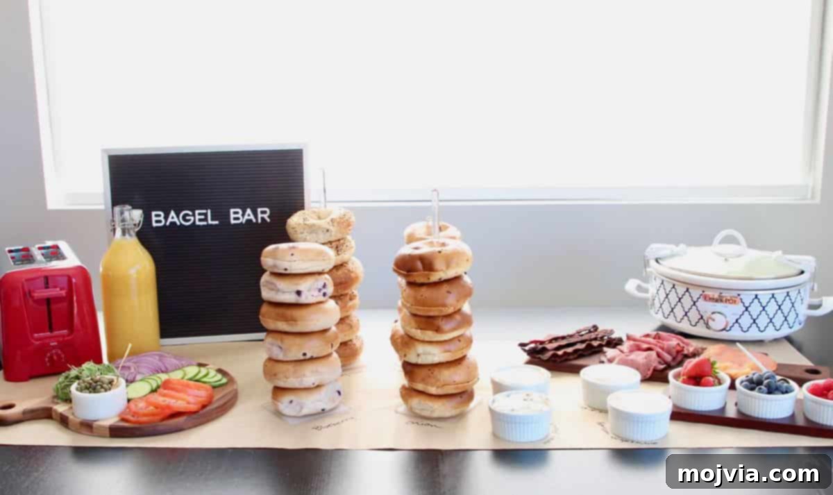 The Easy Bagel Bar Blueprint 5 An overview shot of a well-organized bagel bar table with bagels, cream cheeses, and fresh toppings.
