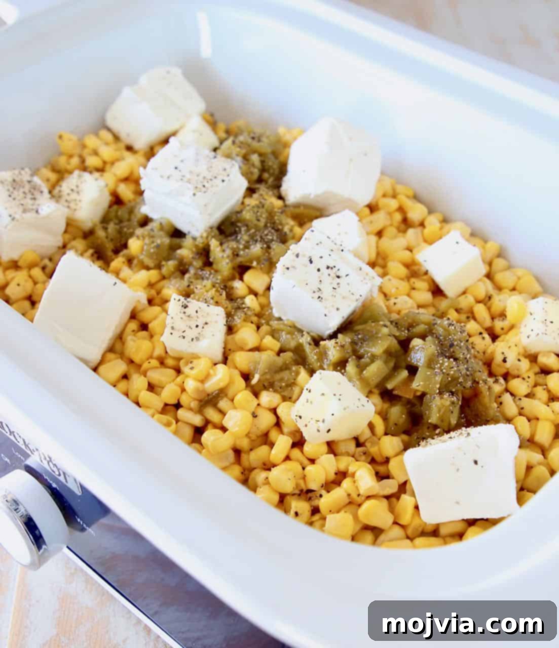 Velvety Slow Cooker Creamed Corn 4 Creamed corn ingredients in crock pot before cooking