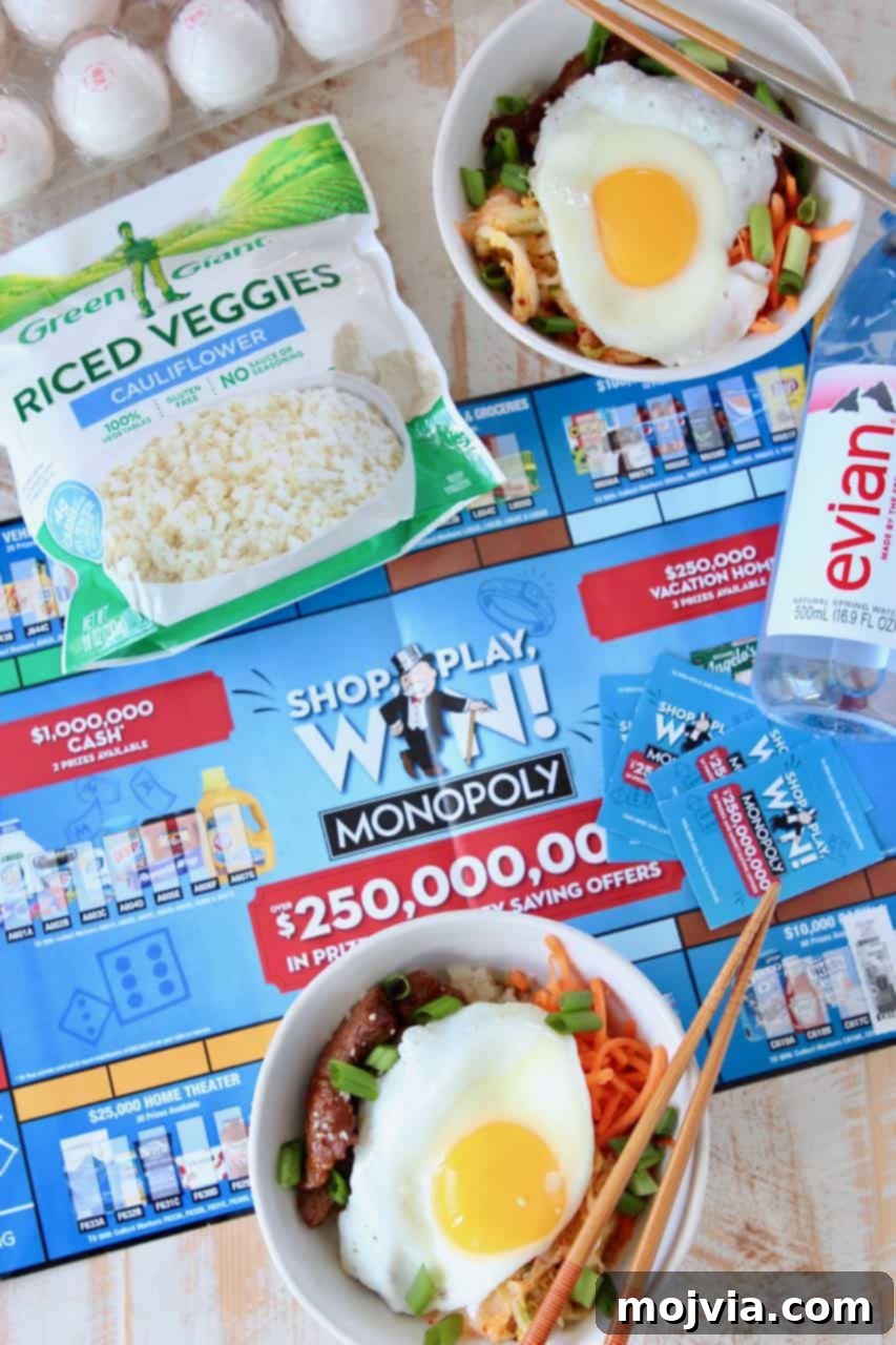 Korean BBQ rice bowls topped with fried egg, sitting on Albertsons monopoly board